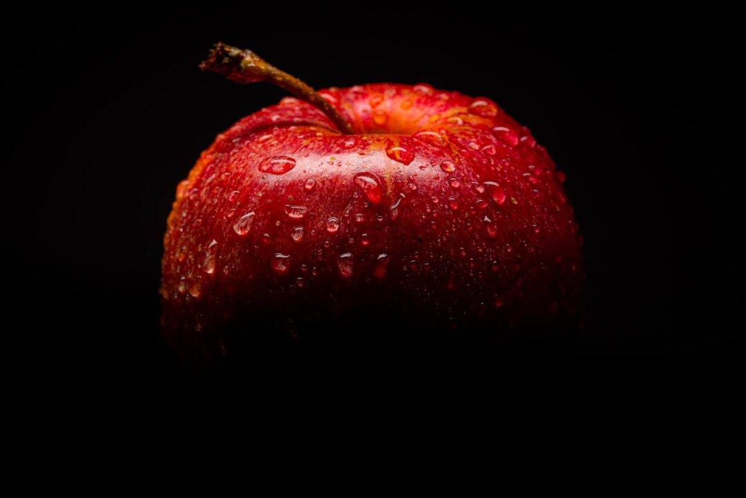 red apple fruit with black background