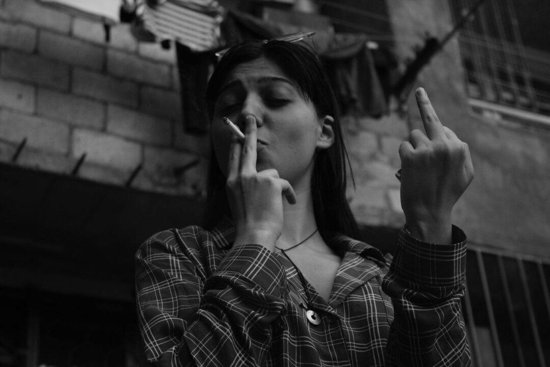 a woman smoking a cigarette