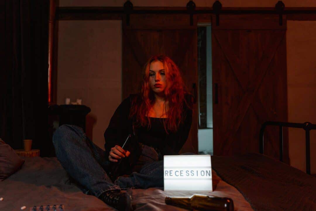 a depressed woman drinking beers