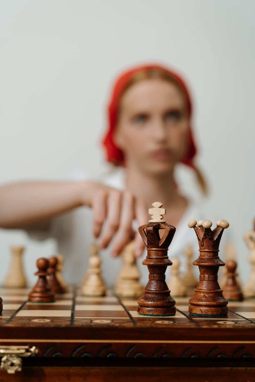 brown wooden chess piece on chess board