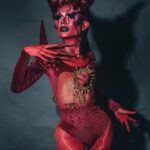 woman in red demon costume