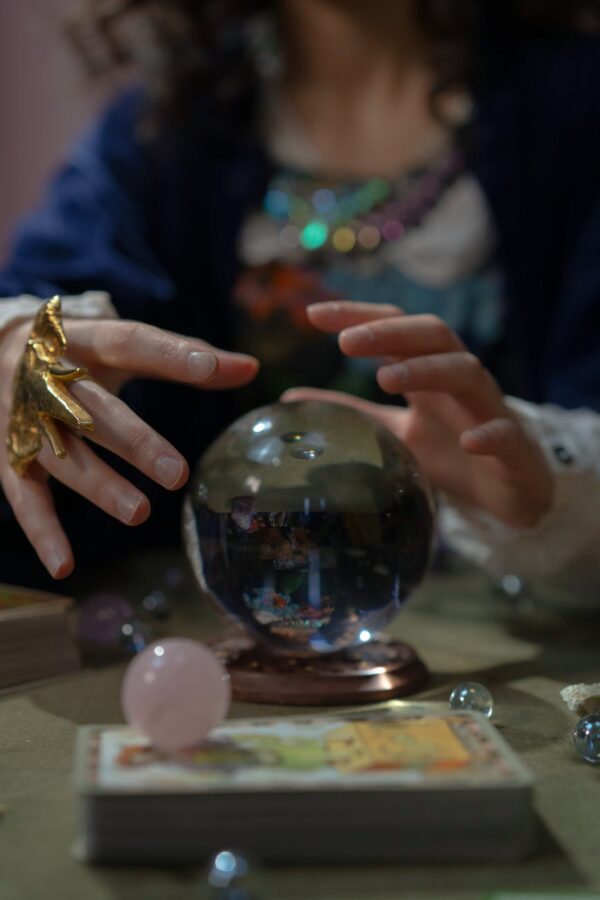 hands over fortune telling crystal ball