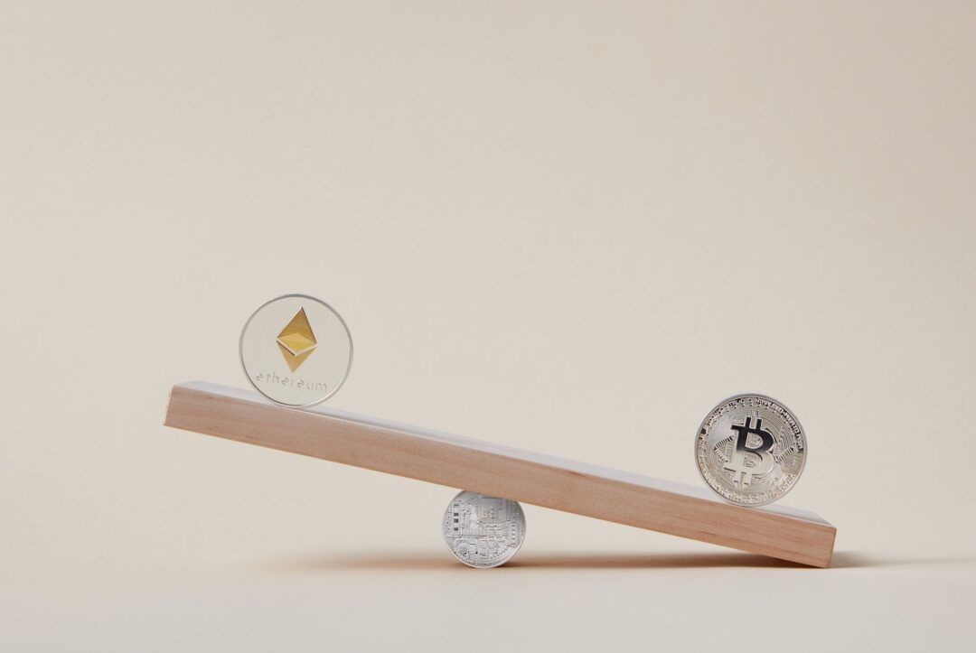 cryptocurrency coins on scales