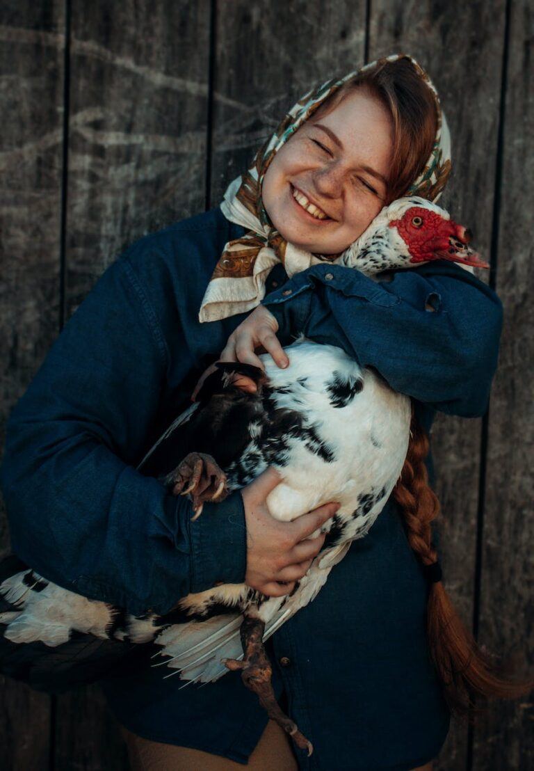 girl smiling and hugging turkey