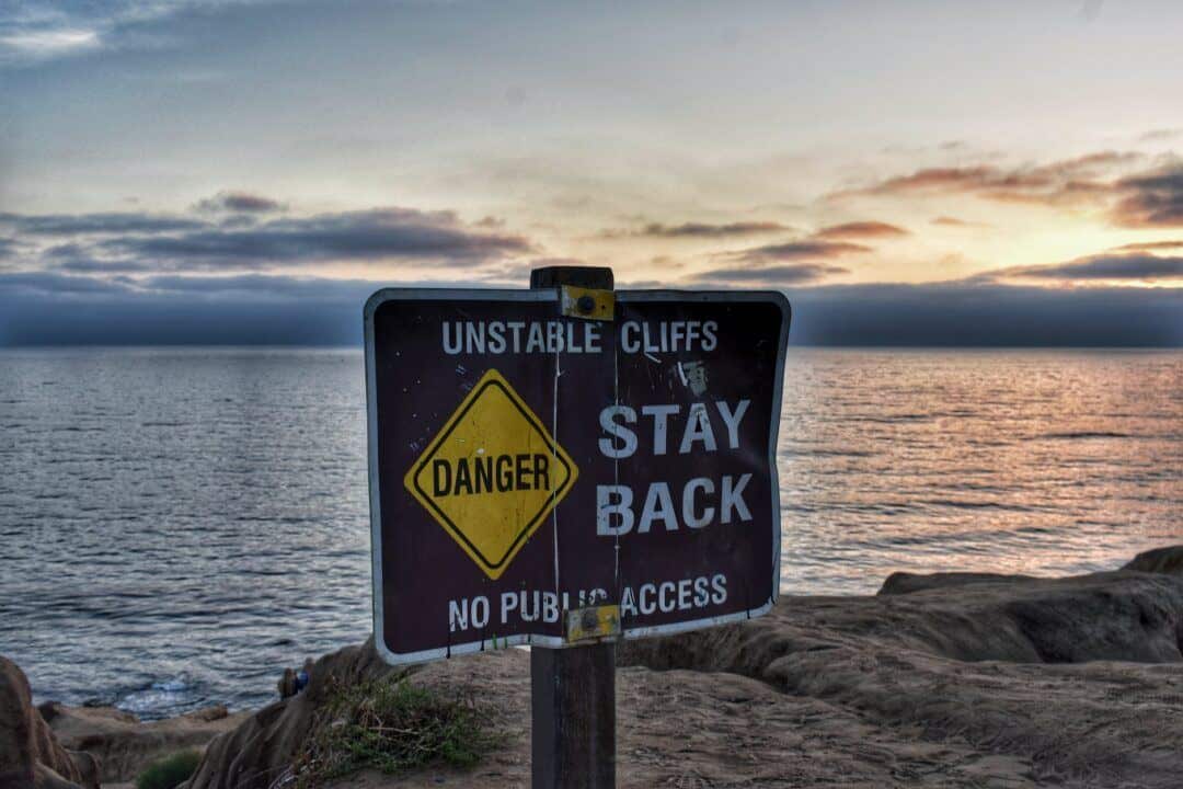 danger stay back signage